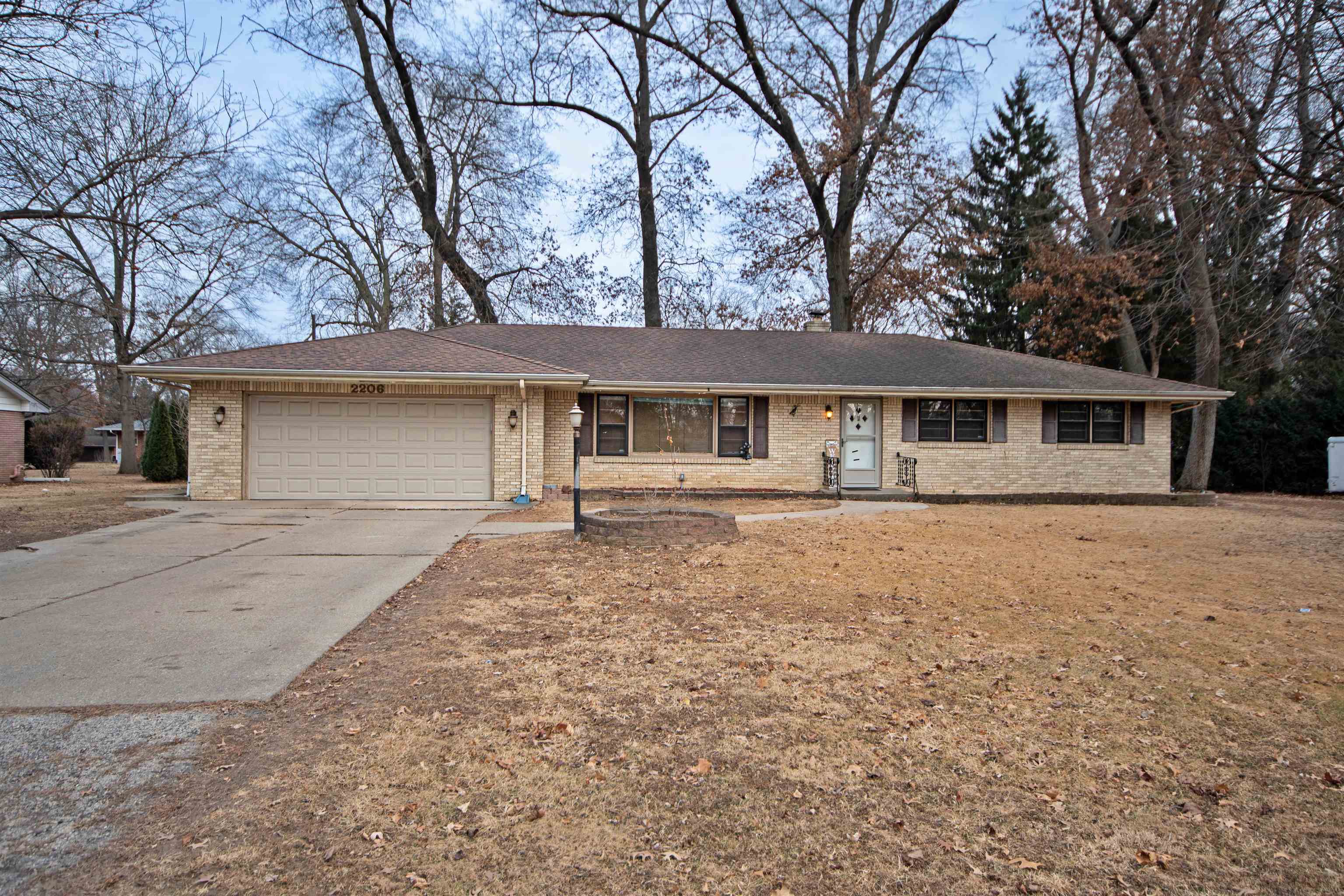 2206 Primrose Trail Rockford, IL 61108 - Photo 1 of 35 a front view of a house with a yard