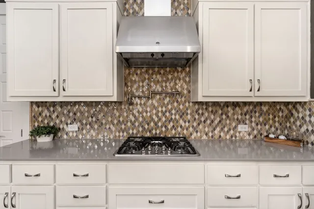 a spacious bathroom with a double vanity sink a mirror a bathtub and shower