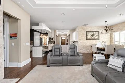 a spacious bathroom with a double vanity sink a mirror a bathtub and shower