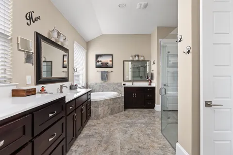 a bedroom with a bed and a ceiling fan