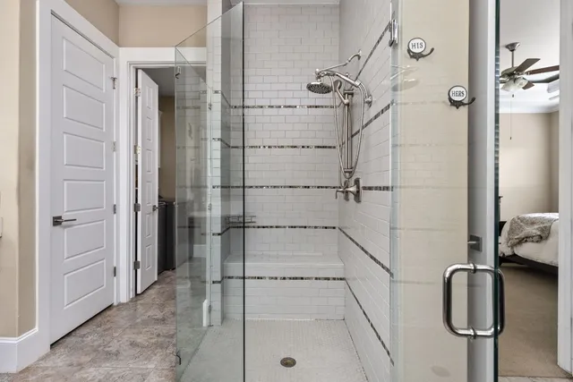 an aerial view of residential houses with swimming pool and ocean view