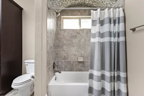 a view of a house with swimming pool and sitting area