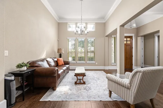 a kitchen with stainless steel appliances kitchen island granite countertop a lot of counter space and wooden floors