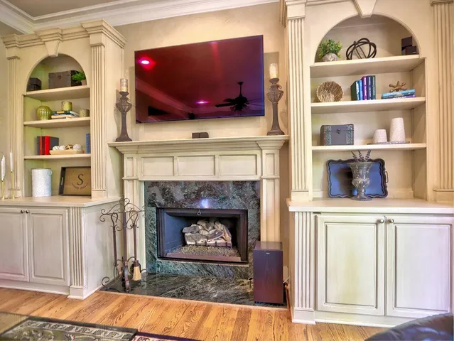 a kitchen with stainless steel appliances granite countertop a sink refrigerator and cabinets