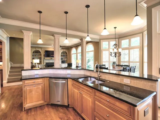 a kitchen with a sink and cabinets