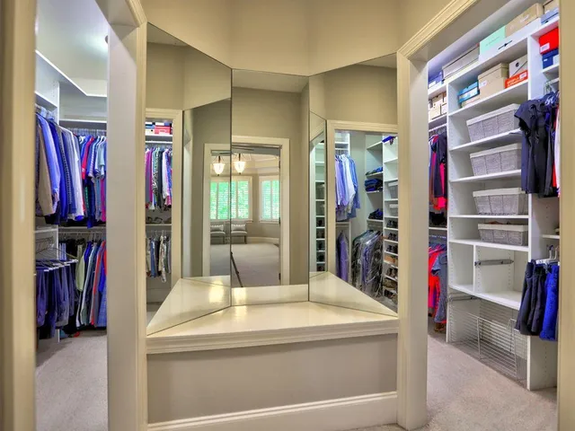 a large bathroom with a large tub sink and vanity