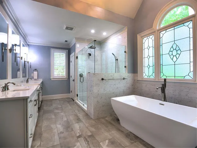 a bathroom with a double vanity sink and a mirror
