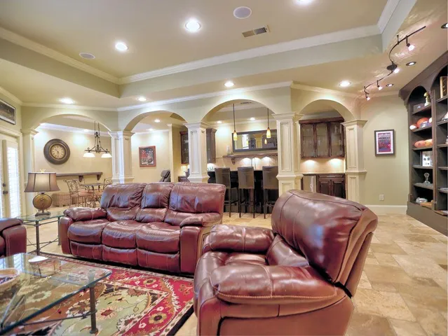 a living room filled with furniture and a table
