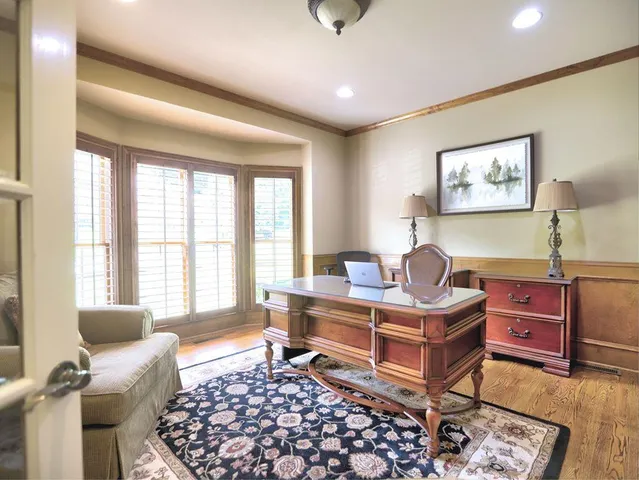 a view of a dining room with furniture and wooden floor