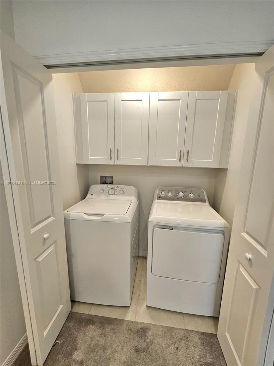 6346 Back Forty Loop Zephyrhills, FL 33541 - Photo 12 of 30 a utility room with dryer and washer