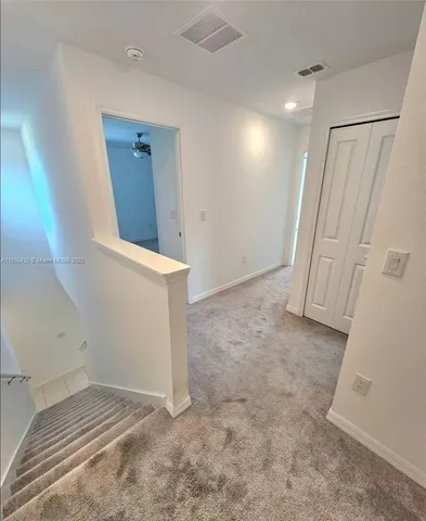 an empty room with a bathroom