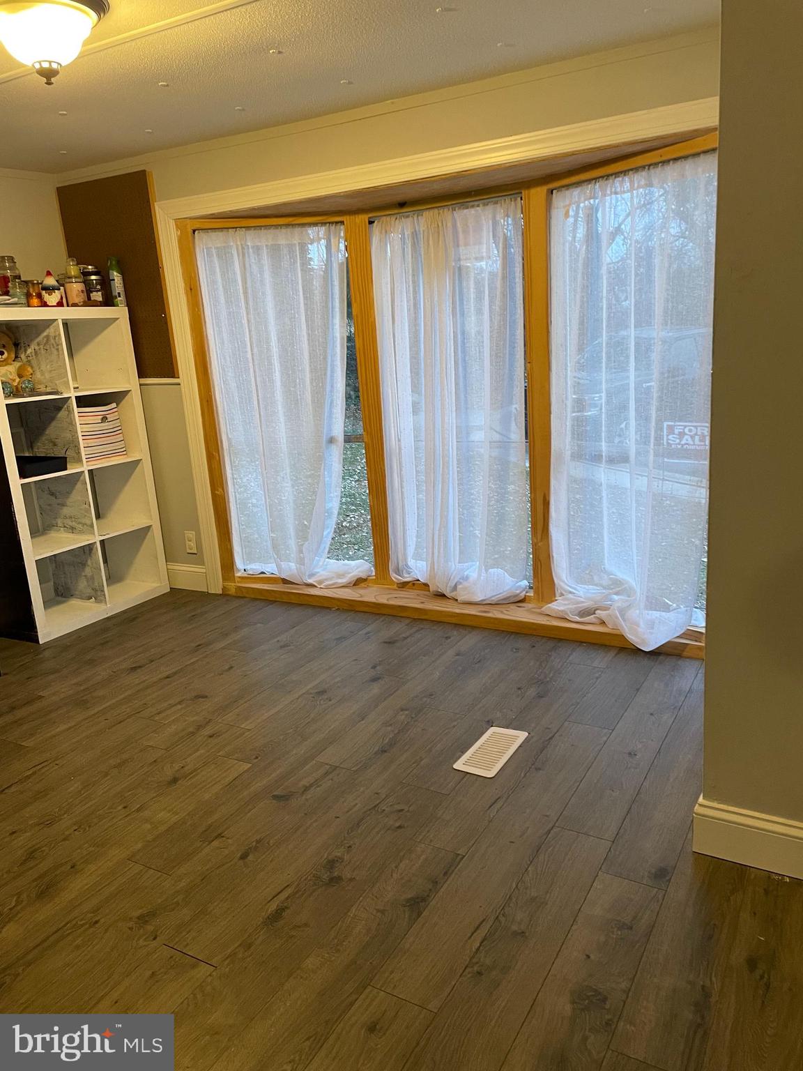 203 Shorewind Road, Unit 203 Bear, DE 19701 - Photo 17 of 20 an empty room with wooden floor and windows