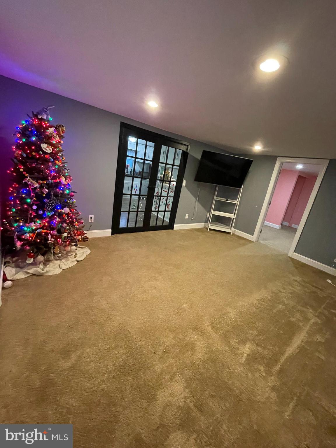 203 Shorewind Road, Unit 203 Bear, DE 19701 - Photo 6 of 20 a view of an empty room with wooden floor