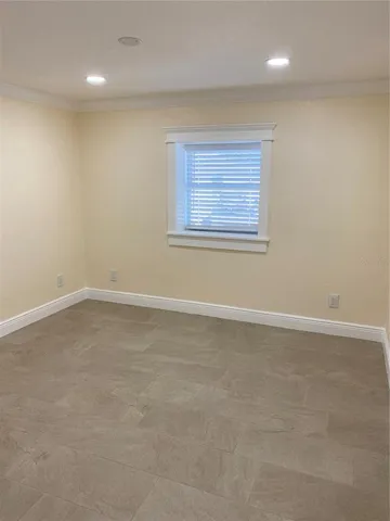 a bathroom with a granite countertop toilet a sink a shower and a mirror