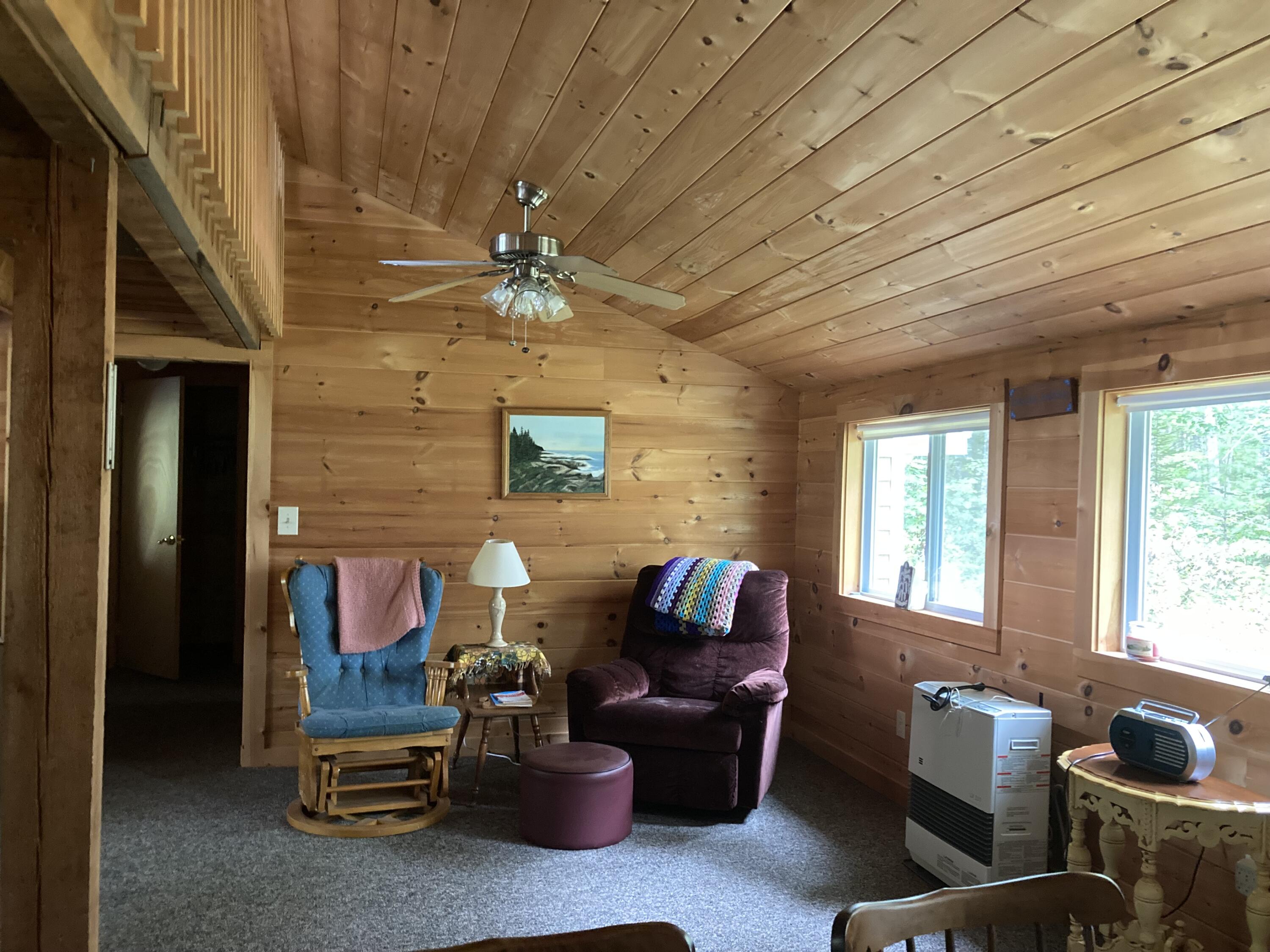 23 South Bay Road Franklin, ME 04634 - Photo 12 of 22 Living room with views of stream.
