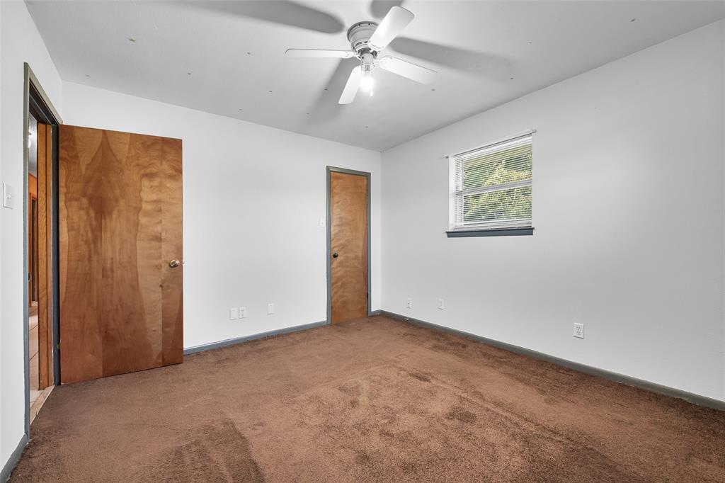3092 North Trinity Street Decatur, TX 76234 - Photo 15 of 29 an empty room with windows and fan
