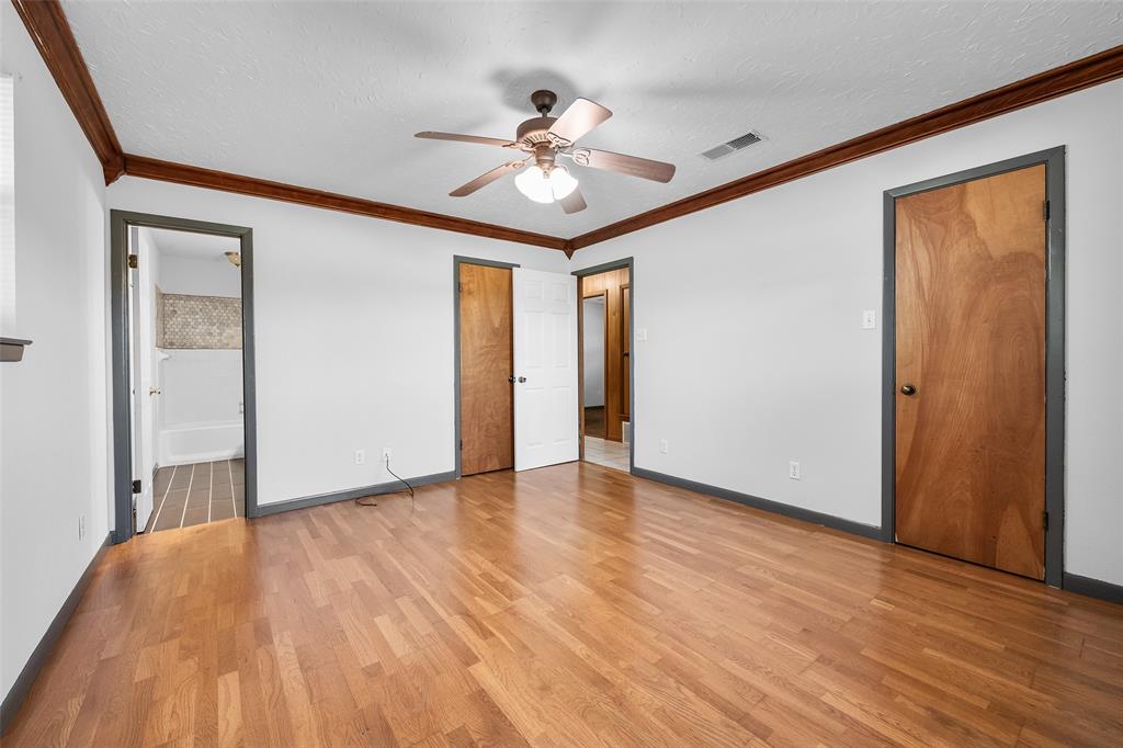 3092 North Trinity Street Decatur, TX 76234 - Photo 17 of 29 a view of a livingroom with a ceiling fan and wooden floor