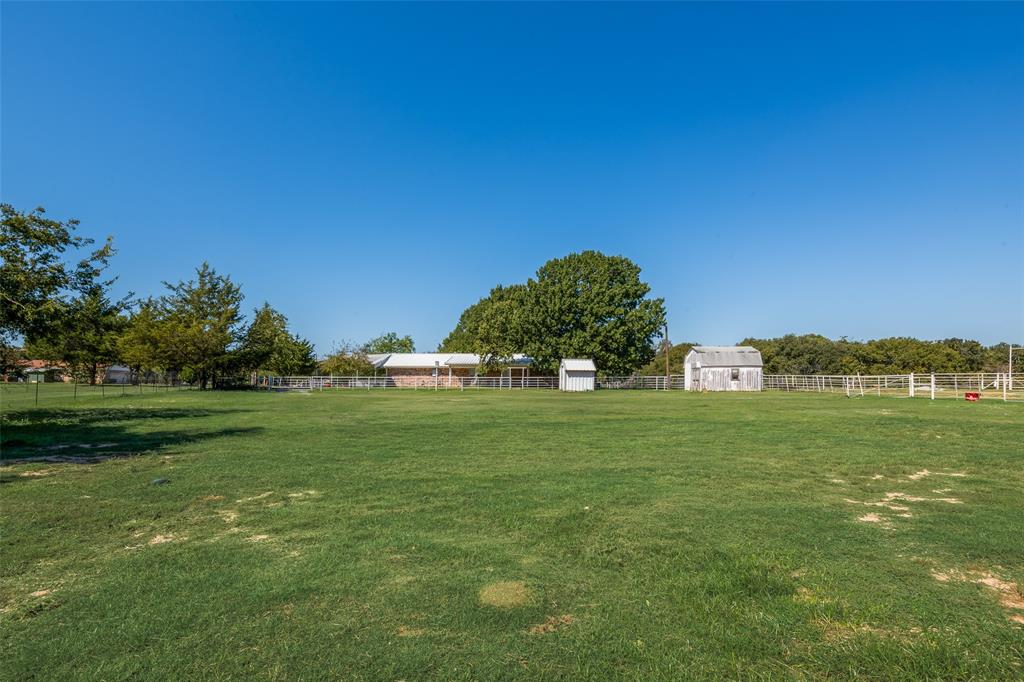 3092 North Trinity Street Decatur, TX 76234 - Photo 22 of 29 a front view of a house with a big yard
