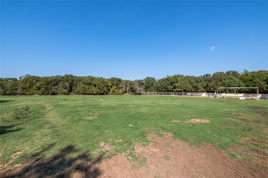 3092 North Trinity Street Decatur, TX 76234 - Photo 26 of 29 a view of outdoor space with green field and trees