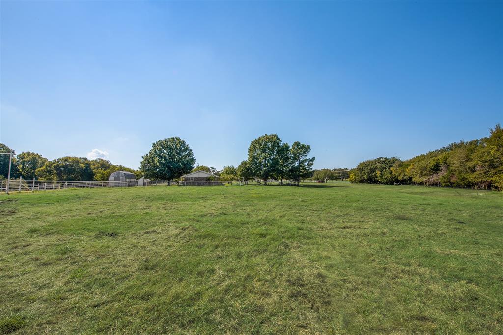 3092 North Trinity Street Decatur, TX 76234 - Photo 28 of 29 a yard with a house in the background