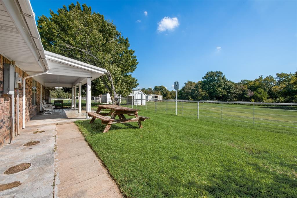 3092 North Trinity Street Decatur, TX 76234 - Photo 29 of 29 a view of a house with backyard porch and sitting area