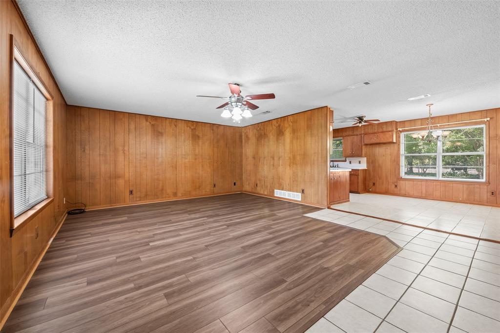 3092 North Trinity Street Decatur, TX 76234 - Photo 5 of 29 wooden floor in an empty room with a window