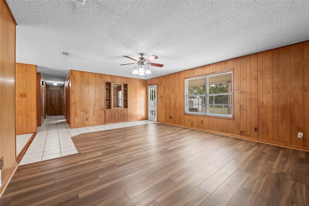 3092 North Trinity Street Decatur, TX 76234 - Photo 6 of 29 wooden floor in an empty room with a window