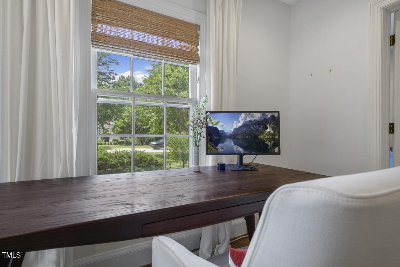 2726 Anderson Drive Raleigh, NC 27608 - Photo 11 of 45 a bedroom with a bed window and desk