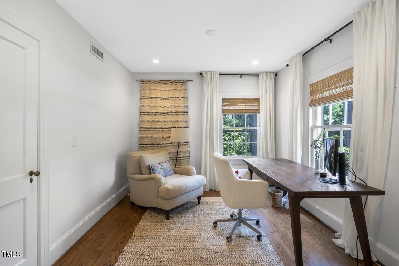 2726 Anderson Drive Raleigh, NC 27608 - Photo 12 of 45 a living room with furniture and a window
