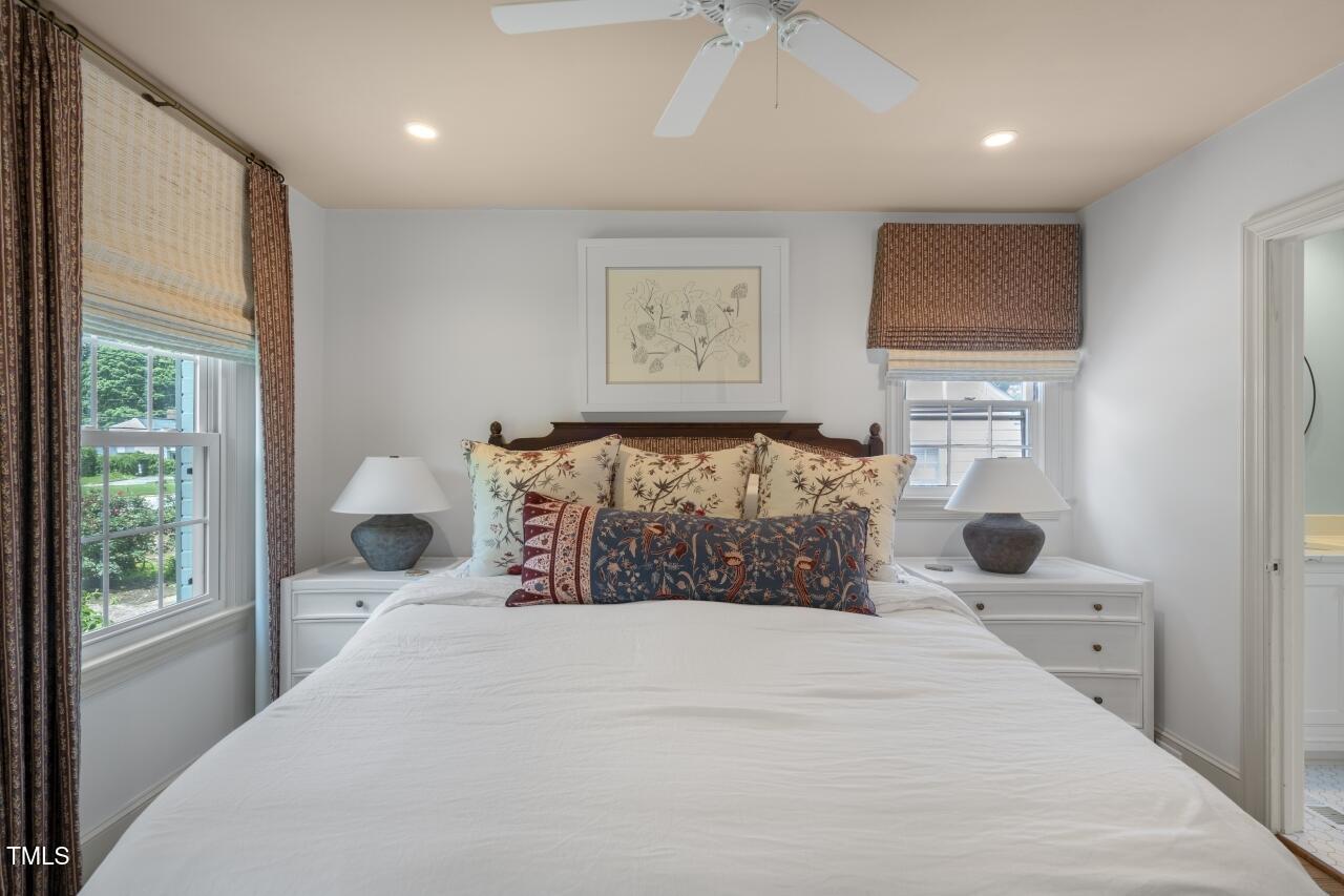 2726 Anderson Drive Raleigh, NC 27608 - Photo 13 of 45 a bedroom with a large bed and a window