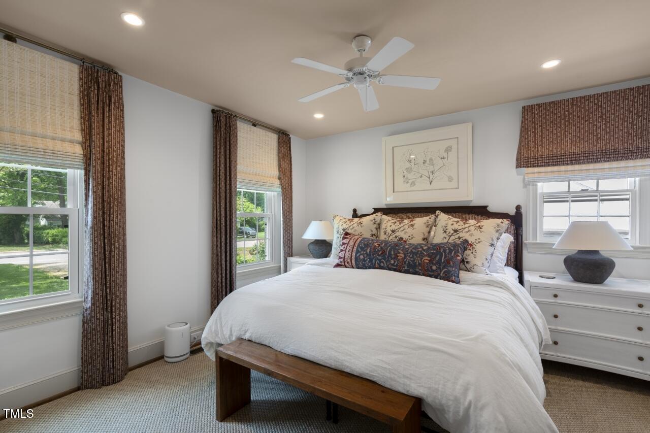 2726 Anderson Drive Raleigh, NC 27608 - Photo 14 of 45 a bedroom with a large bed and a window