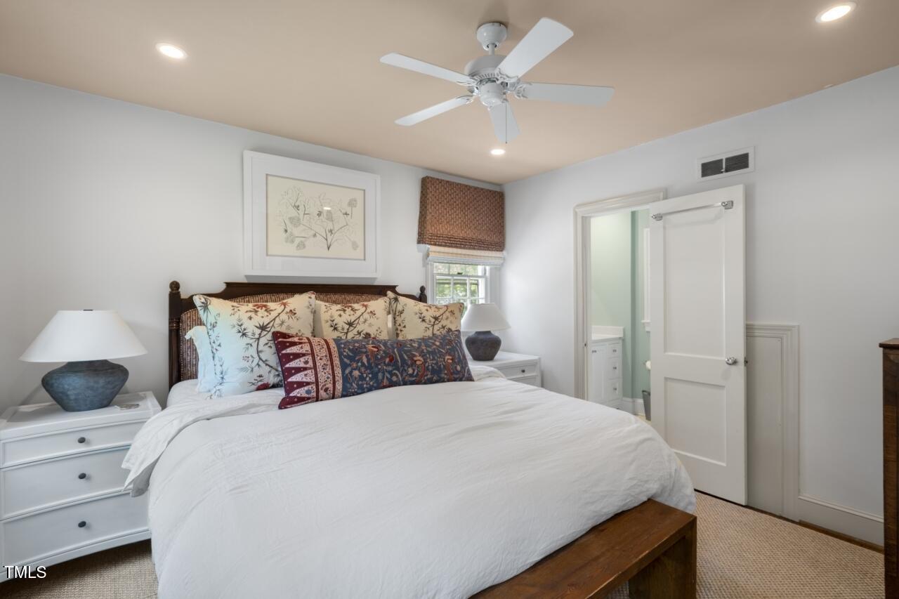 2726 Anderson Drive Raleigh, NC 27608 - Photo 15 of 45 a bedroom with a bed and a window
