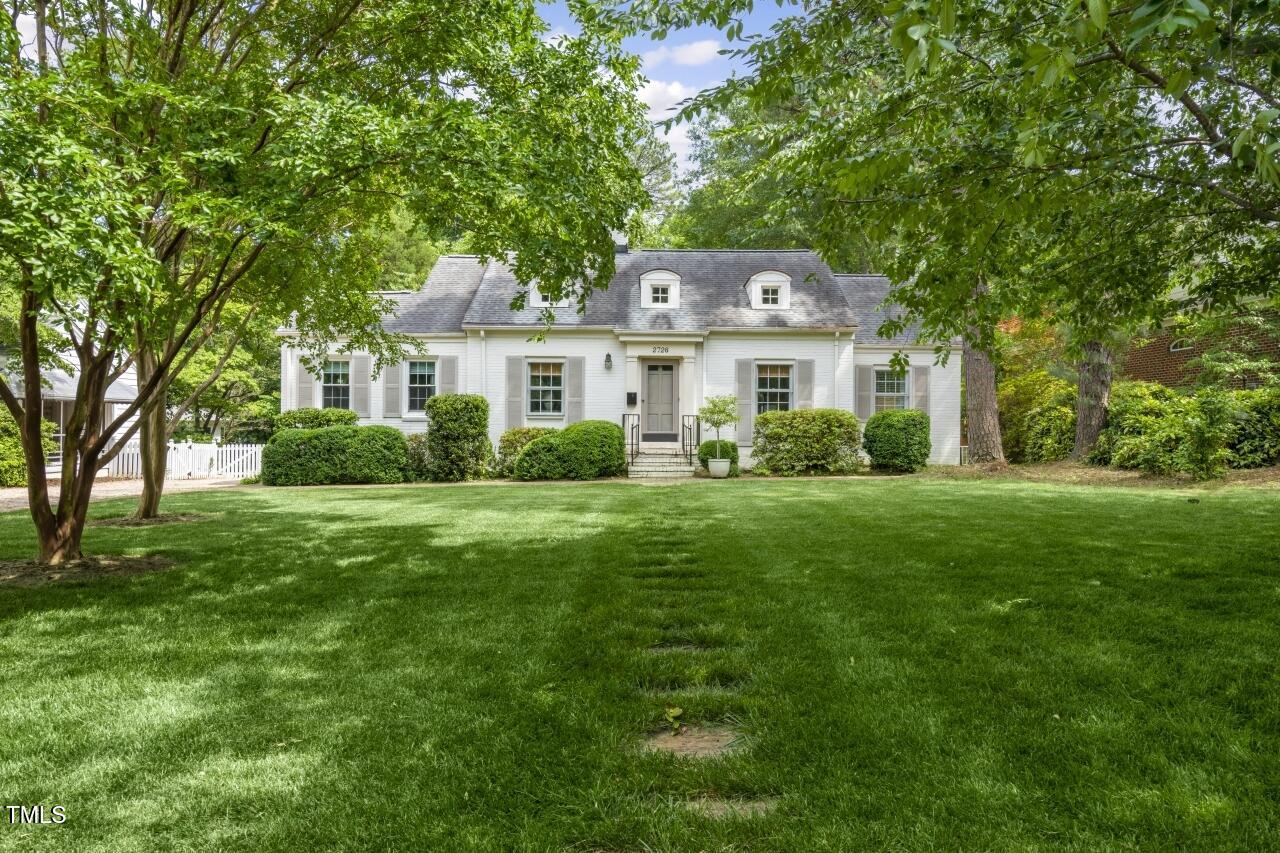 2726 Anderson Drive Raleigh, NC 27608 - Photo 2 of 45 a front view of a house with a garden