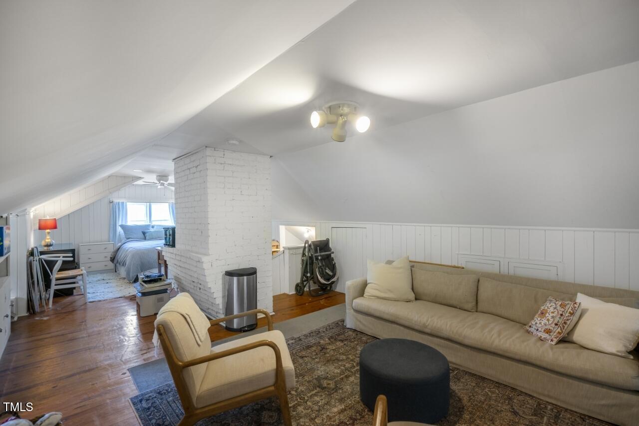 2726 Anderson Drive Raleigh, NC 27608 - Photo 30 of 45 a living room with furniture and wooden floor