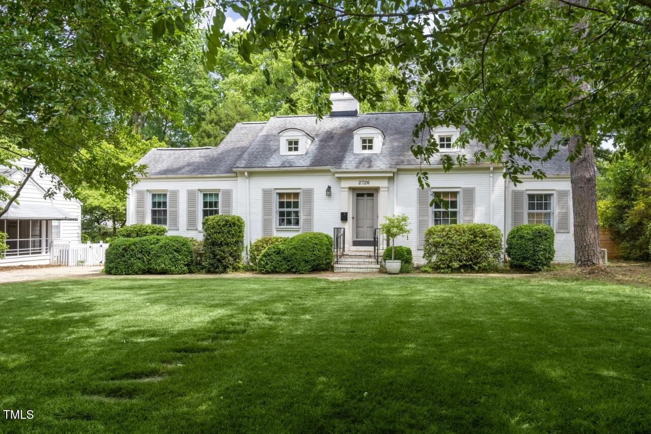 2726 Anderson Drive Raleigh, NC 27608 - Photo 3 of 45 a front view of a house with a garden