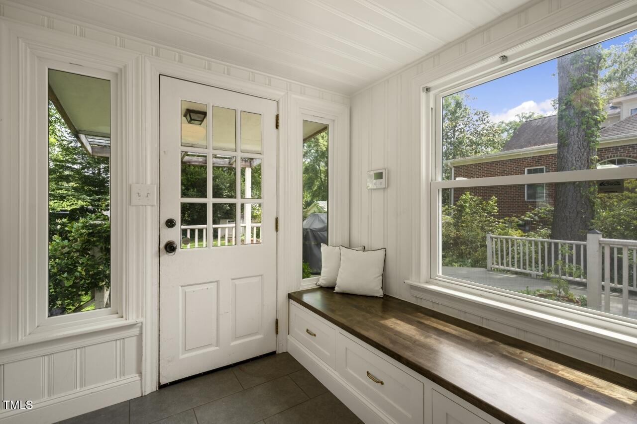 2726 Anderson Drive Raleigh, NC 27608 - Photo 36 of 45 a spacious bathroom with a granite countertop tub and a window