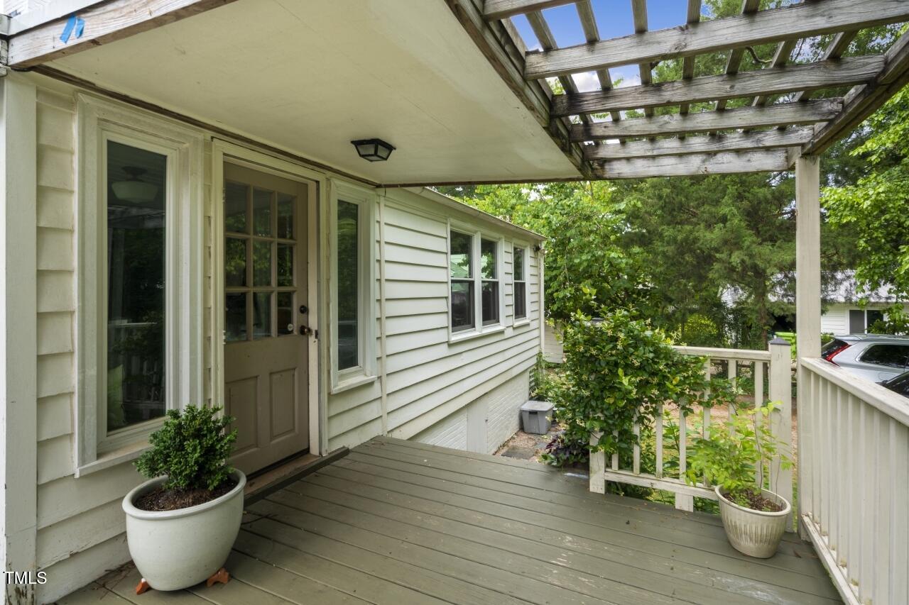 2726 Anderson Drive Raleigh, NC 27608 - Photo 37 of 45 a porch with seating space and potted plants