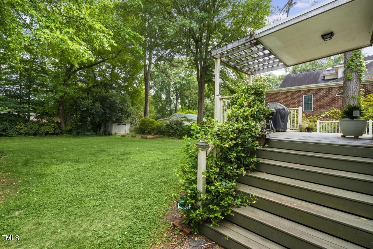 2726 Anderson Drive Raleigh, NC 27608 - Photo 40 of 45 a view of a house with a yard