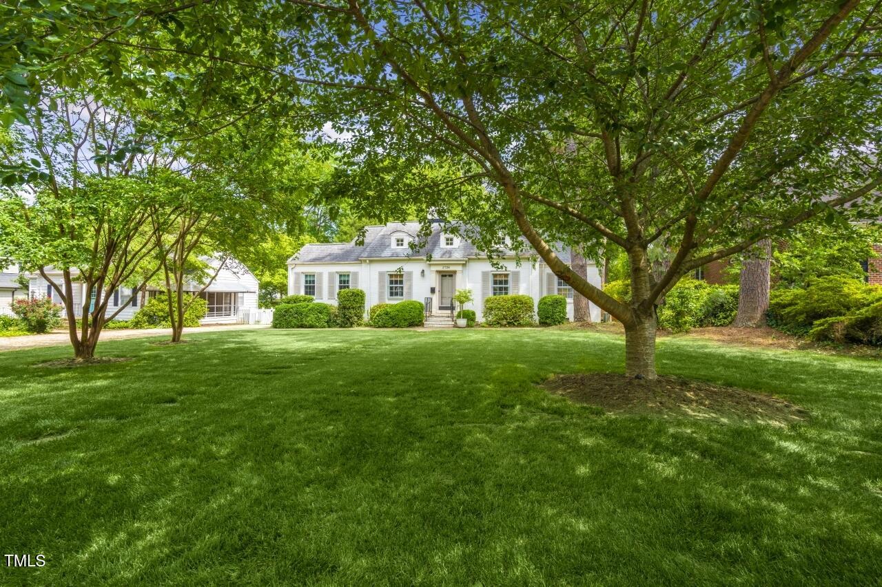 2726 Anderson Drive Raleigh, NC 27608 - Photo 4 of 45 a front view of a house with a yard