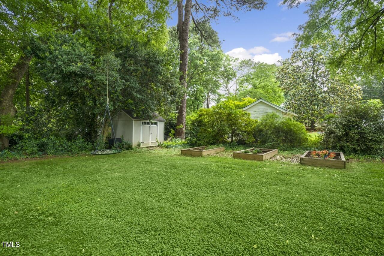 2726 Anderson Drive Raleigh, NC 27608 - Photo 45 of 45 a view of a house with backyard