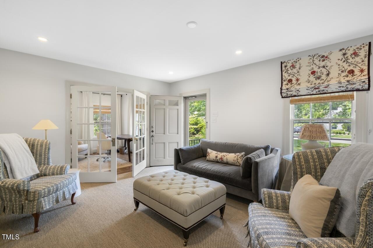 2726 Anderson Drive Raleigh, NC 27608 - Photo 8 of 45 a living room with furniture and a large window