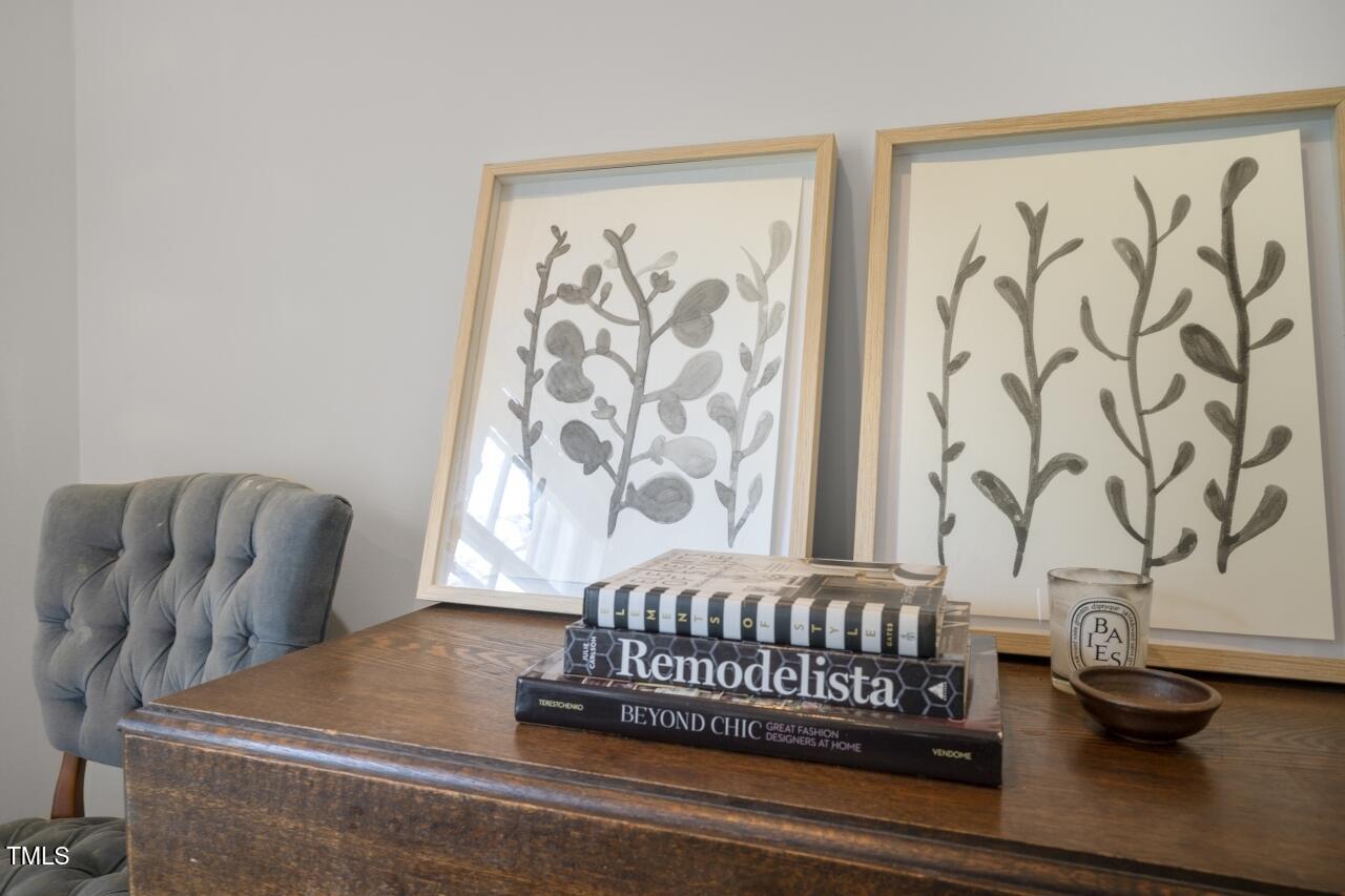 2726 Anderson Drive Raleigh, NC 27608 - Photo 9 of 45 a bedroom with a bed and a chair