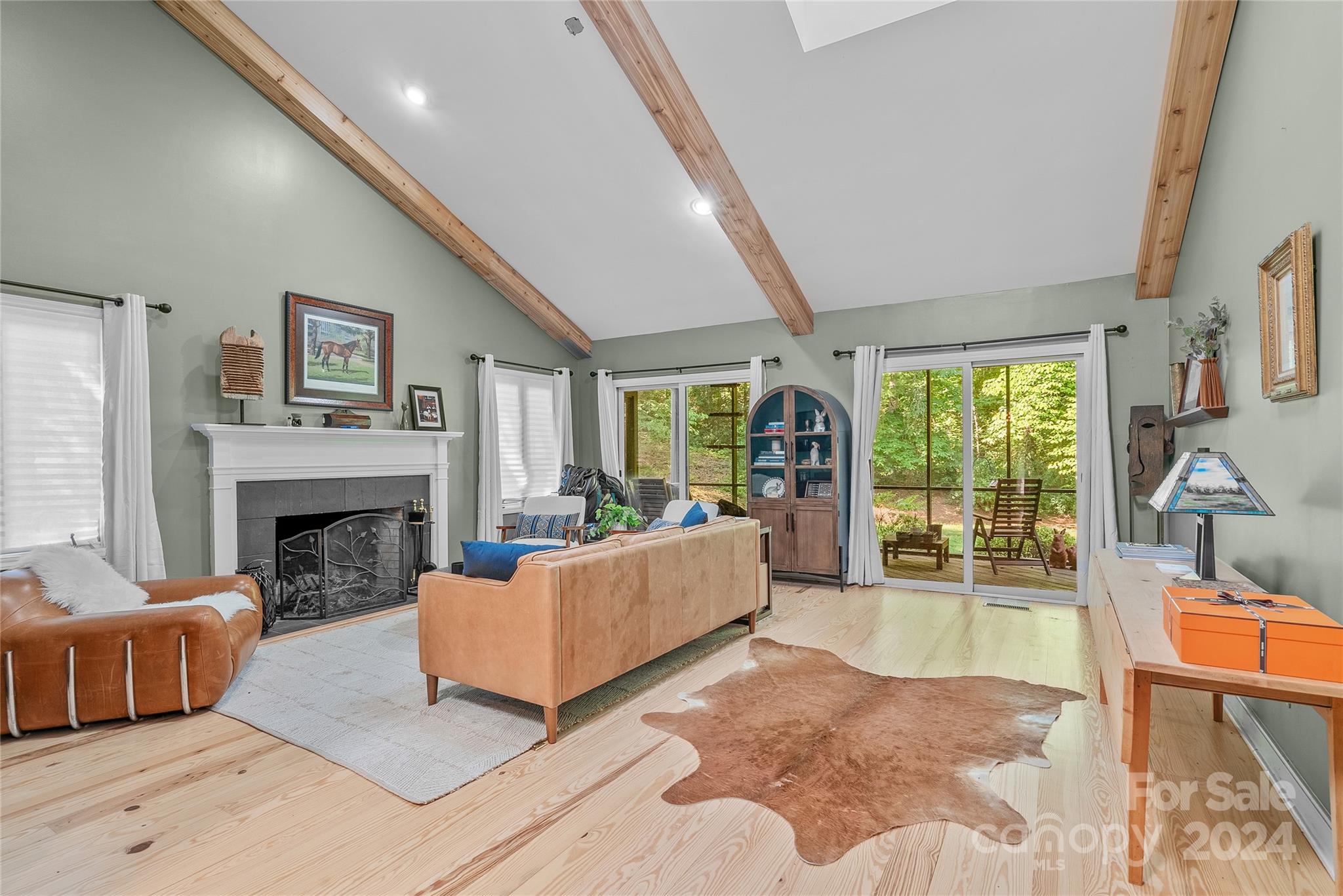 7 Hunting Country Trail Tryon, NC 28782 - Photo 5 of 39 a living room with furniture and a fireplace
