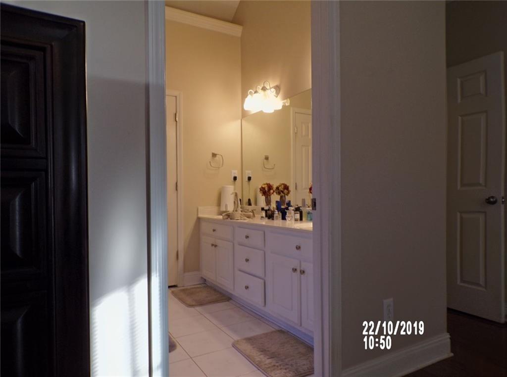 1035 Upchurch Road McDonough, GA 30252 - Photo 15 of 48 a bathroom with a sink and a mirror
