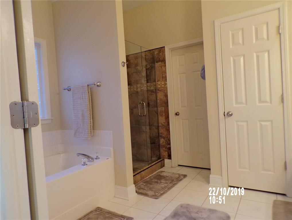 1035 Upchurch Road McDonough, GA 30252 - Photo 16 of 48 a bathroom with a shower