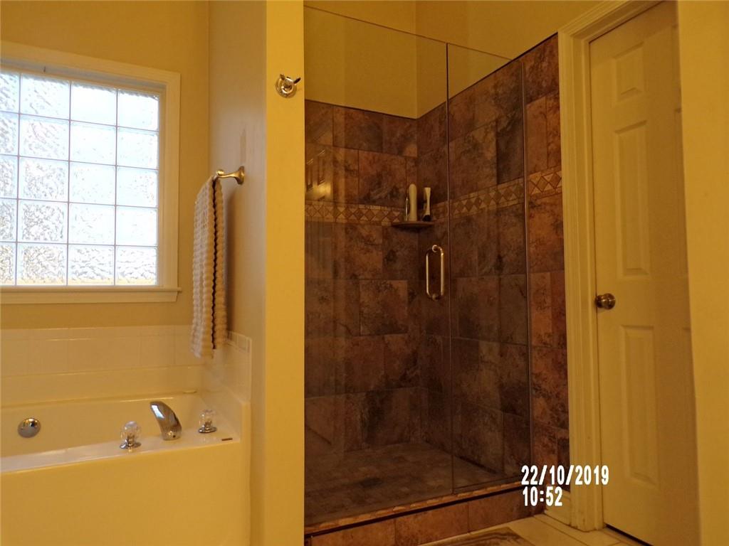 1035 Upchurch Road McDonough, GA 30252 - Photo 17 of 48 a bathroom with a shower