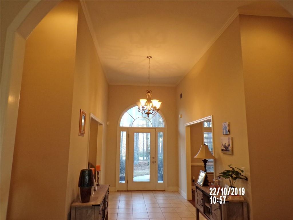 1035 Upchurch Road McDonough, GA 30252 - Photo 19 of 48 a room with dining table and a chandelier