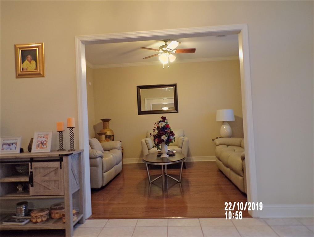1035 Upchurch Road McDonough, GA 30252 - Photo 20 of 48 a living room with furniture and wooden floor