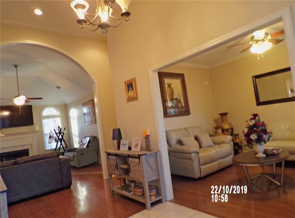 1035 Upchurch Road McDonough, GA 30252 - Photo 21 of 48 a living room with furniture and a chandelier