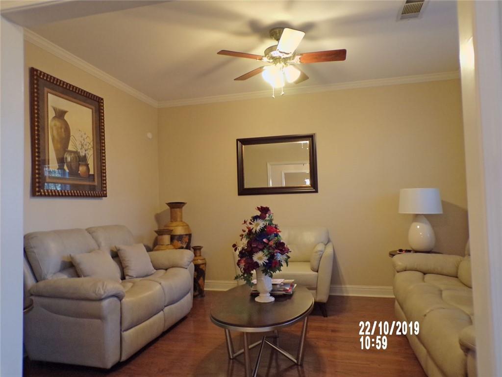 1035 Upchurch Road McDonough, GA 30252 - Photo 22 of 48 a living room with furniture and a chandelier